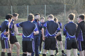 boys having a team talk in rugby