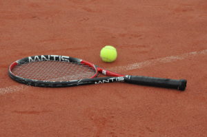 photo of tennis racket and ball