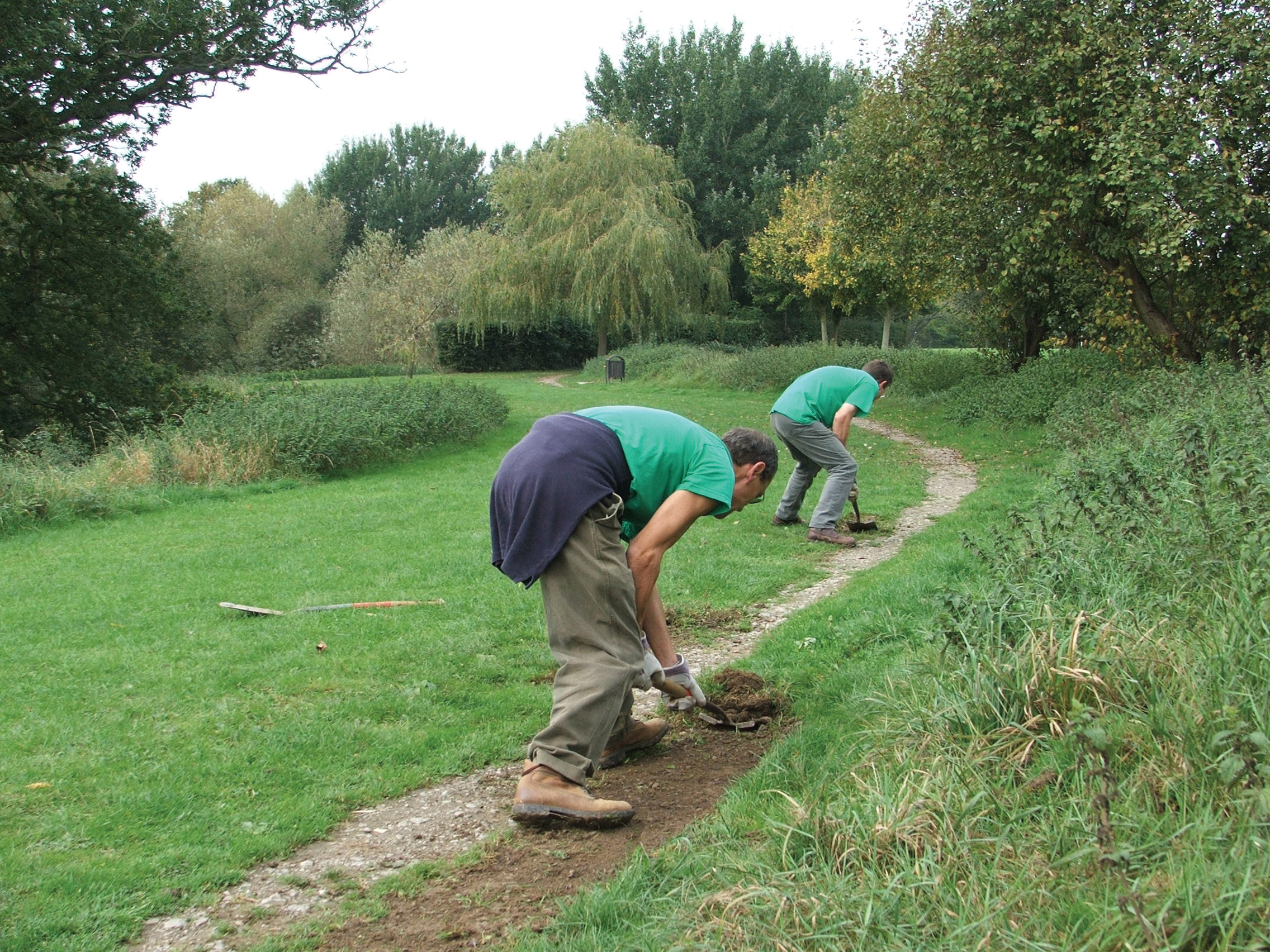 men working on creating a footpath