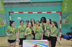 photo of winning handball team collecting their medals at Kent School Games event