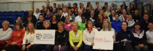 photo of attendees at female coaches conference