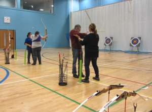 people participating in archery sessions