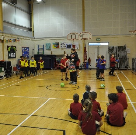 Children playing sports in the hall