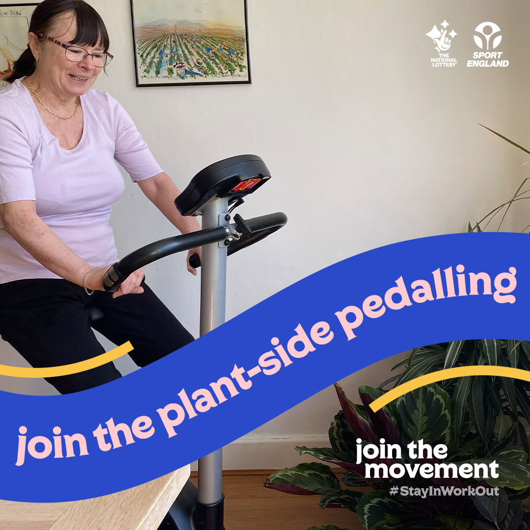 woman on exercise bike in living room