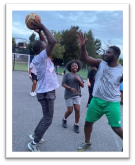 Men playing basketball