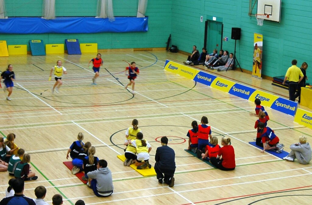 children competing in sports hall athletics