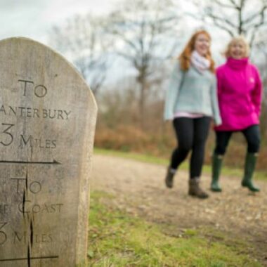 two ladies walking along path