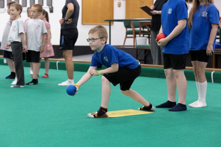 young person playing bowls