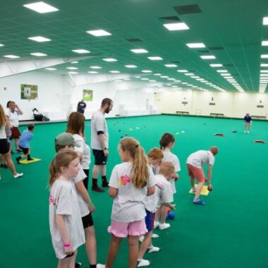 young people playing bowls