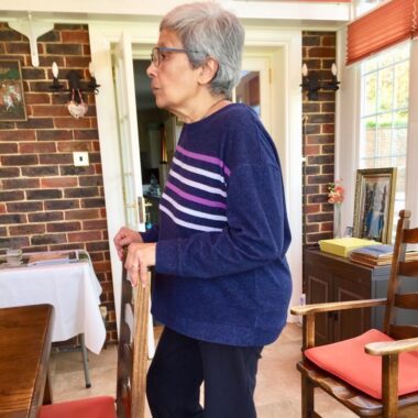 Lady using chair to support pilates