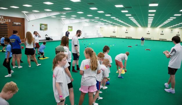 young people playing bowls