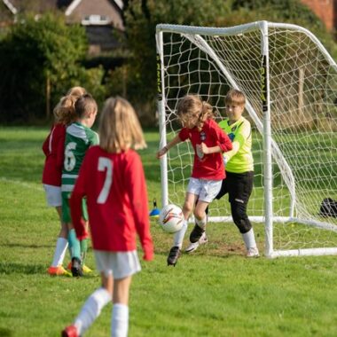 children playing football