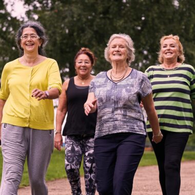 four ladies walking in the park