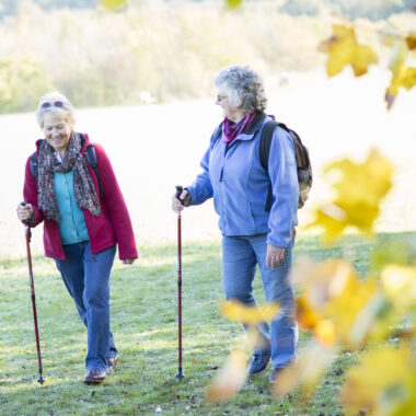 women walking across a field