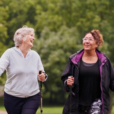 two ladies nordic walking in the park