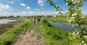 two people walking along the thames path