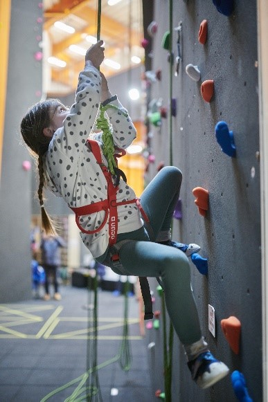 young person on a climbing wall