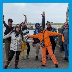 Group of people on a walk along the beach