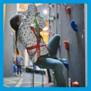 young person on a climbing wall