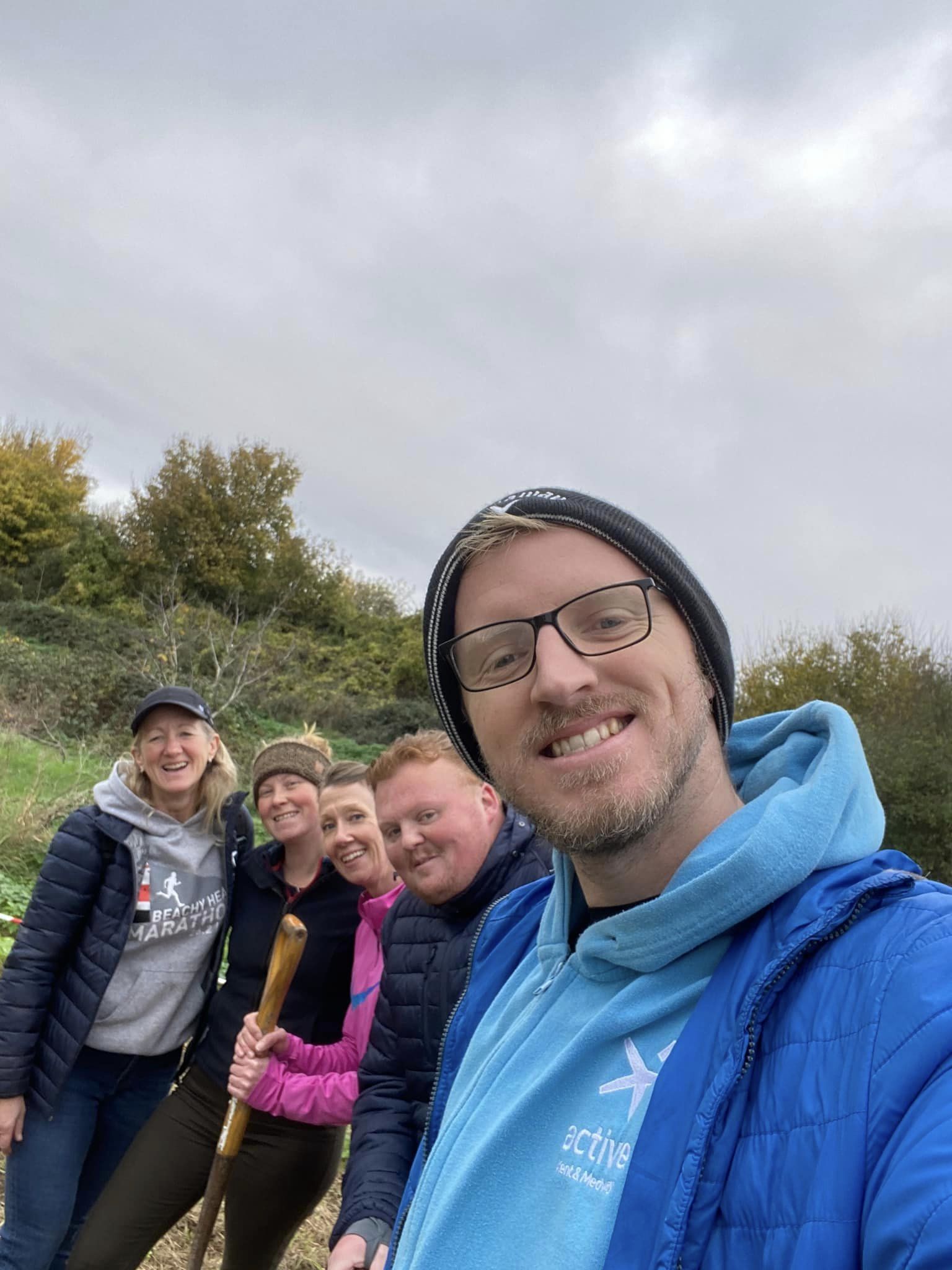 5 people smiling to camera