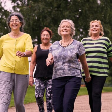 four ladies walking in the park