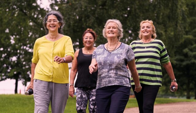 four ladies walking in the park