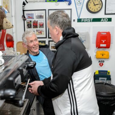 two people making a coffee in a club house