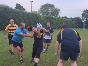 Group of people playing walking rugby