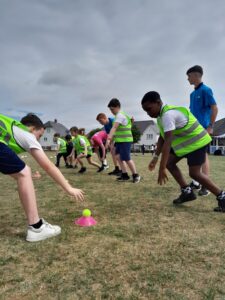 young people playing sport on a field