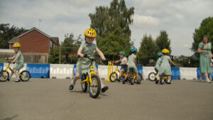 young person on a bike in a playground