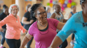 Woman smiling whilst dancing at a zumba class