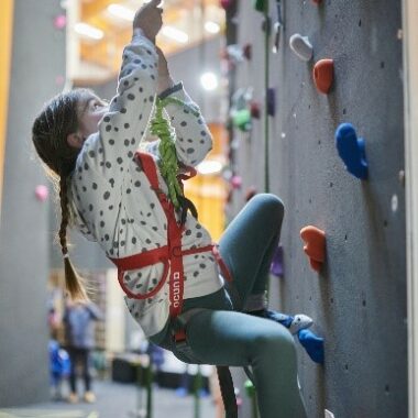 young person on a climbing wall
