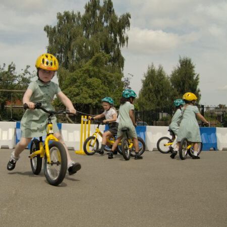 young person on a bike in a playground
