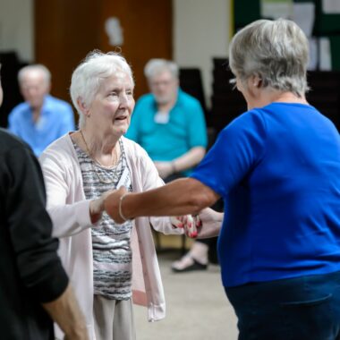lady in an exercise class in a community hall
